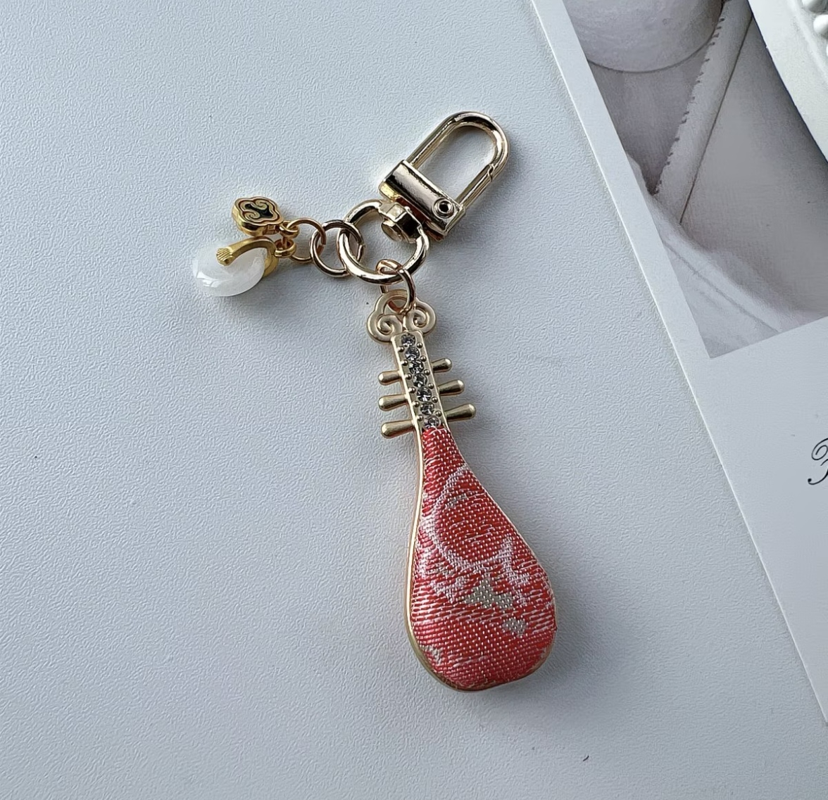 Red pattern pipa‑shaped keychain, Chinese silk fabric bag charm souvenir