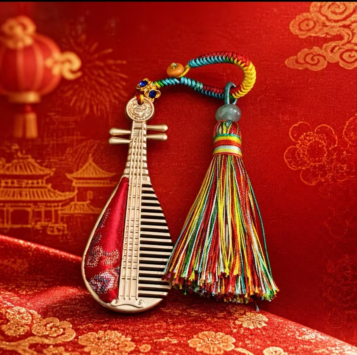 Red pipa‑shaped tassel keychain, Chinese handicraft souvenir