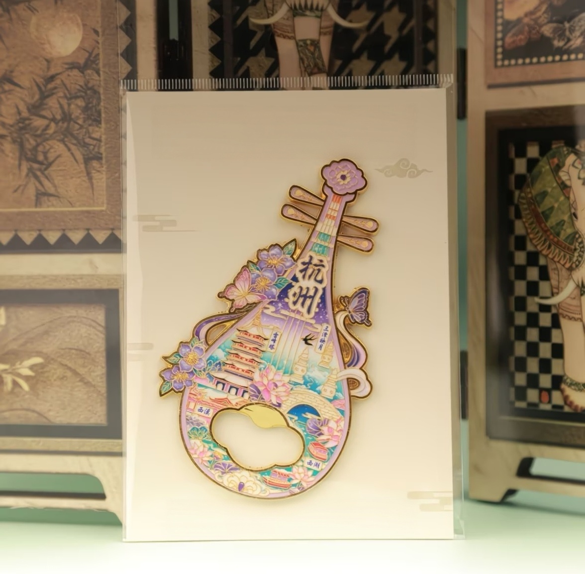 Pipa shaped 2‑in‑1 bottle opener and fridge magnet, pink‑purple tone Chinese‑style souvenir with Hangzhou West Lake landmarks